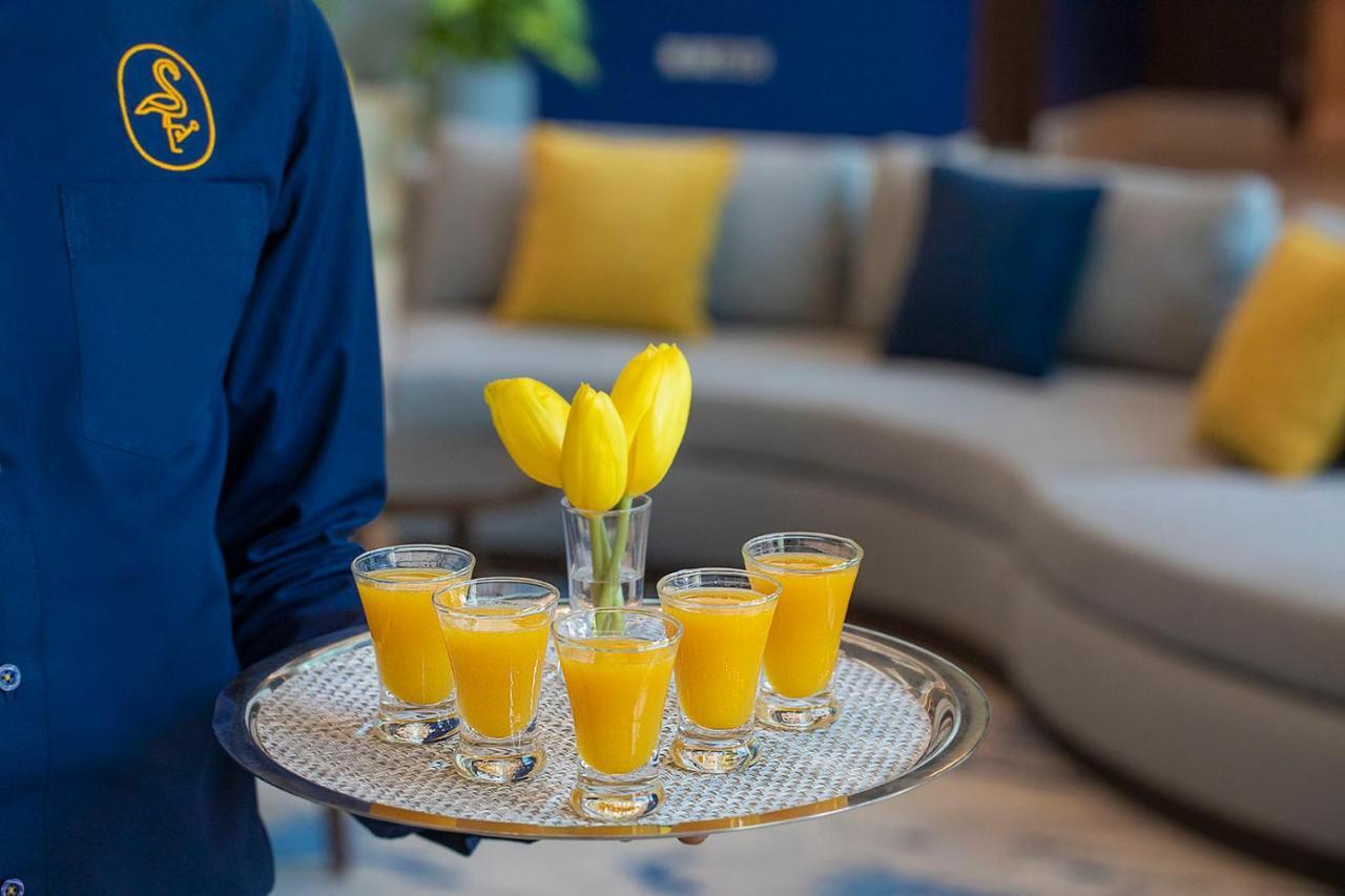 Voco Al Khobar By Ihg Hotel Kültér fotó A tray of orange juice